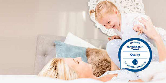 Mamá y niño en la cama, Sello de Calidad Hohenstein